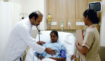 Medical oncologist Nageswara Reddy examining a patient