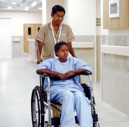 Patient and nurse at SVICCAR, where charges for the poor are nominal