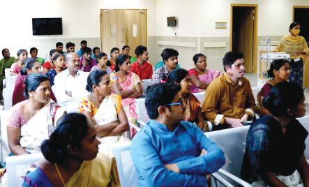 Visitors in the well-appointed waiting area of the hospital